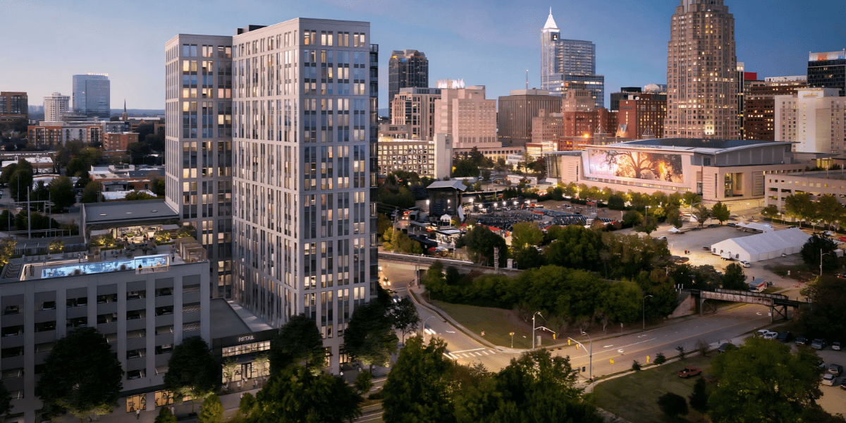City skyline featuring modern buildings and greenery at dusk in Raleigh, North Carolina
