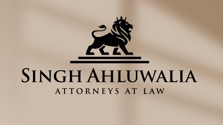 Singh Ahluwalia Attorneys at Law logo with a lion symbol, representing strength, justice, and compassionate legal advocacy.