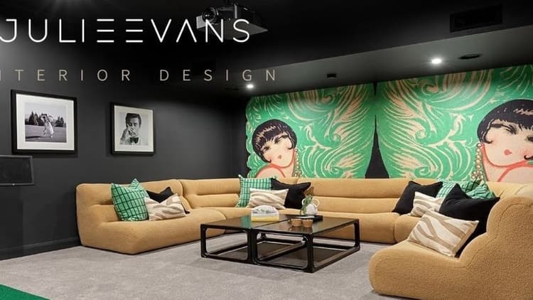 Stylish home theater designed by Julie Evans Design, featuring vibrant wall art, cozy seating, and modern decor.