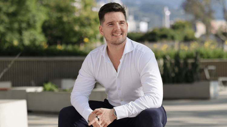 David Peter Mayer smiling outdoors, showcasing confidence and clarity in real estate investment.