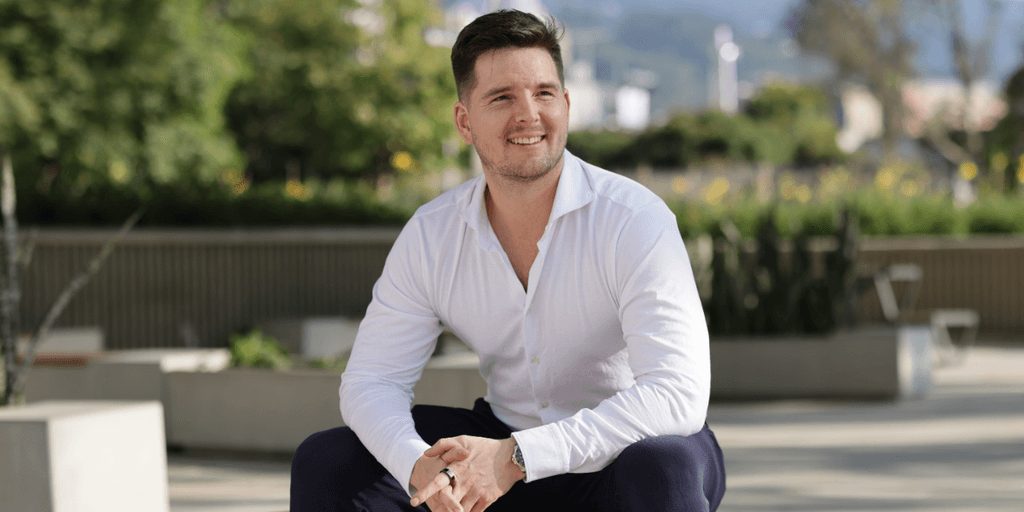 David Peter Mayer smiling outdoors, showcasing confidence and clarity in real estate investment.