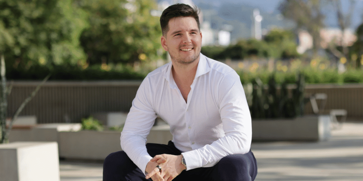 David Peter Mayer smiling outdoors, showcasing confidence and clarity in real estate investment.