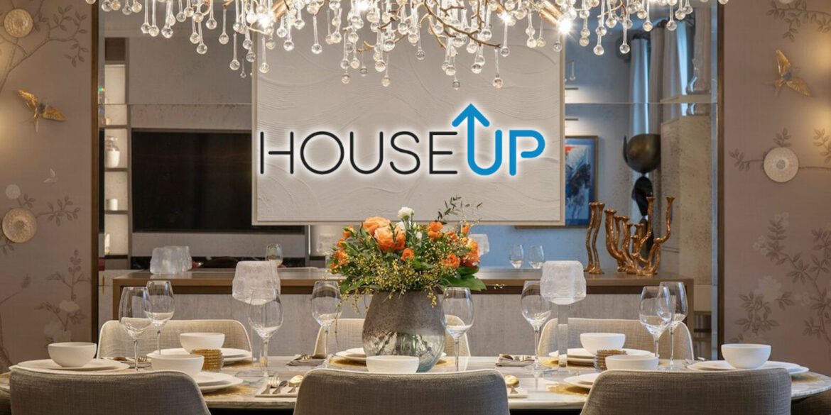 Luxurious dining area featuring modern design with elegant table settings, a floral arrangement, and the houseUP logo.