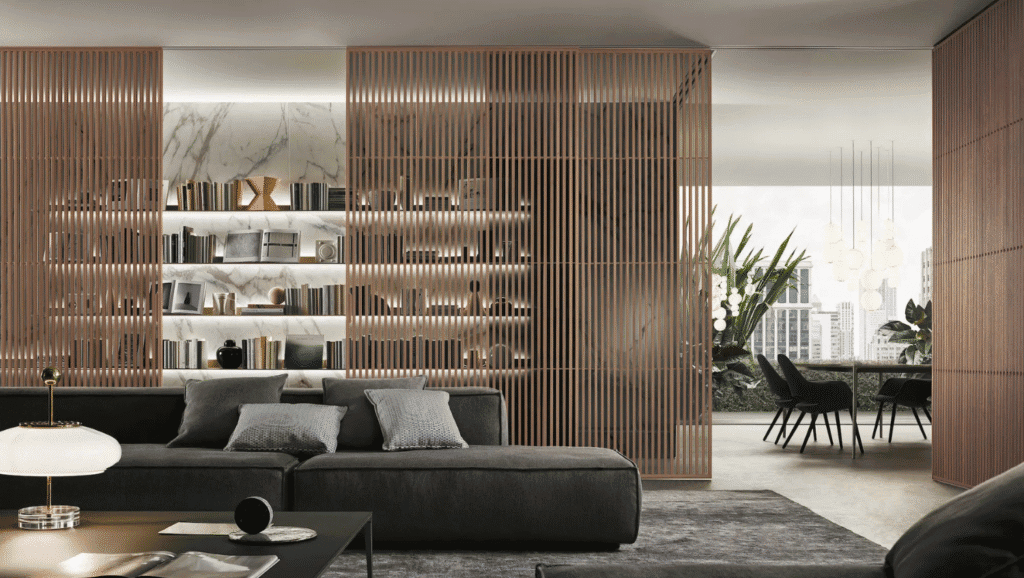 Modern luxury living room with wood slat partitions, marble shelving, and an open-plan dining area.
